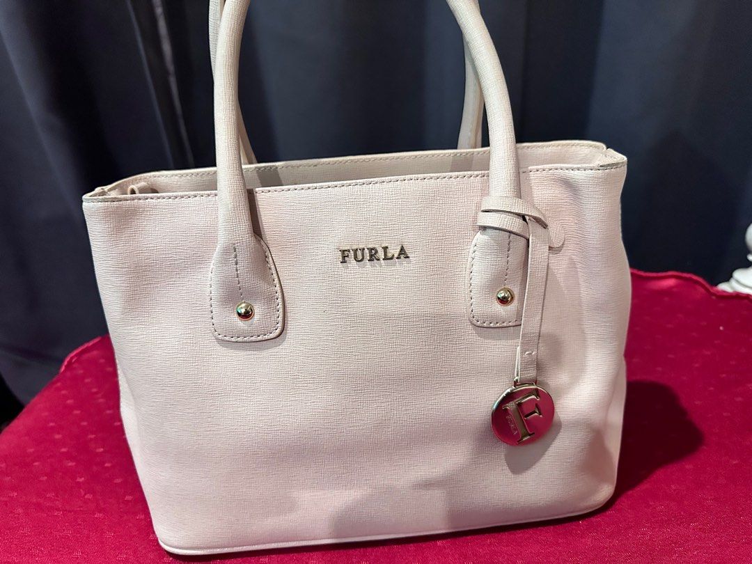 Authentic Furla Bag (Category: Luxury Bags & Wallets) located in Rizal. Submitted by SummerPeaCloset (Listing ID 1299697582, Image 1). Description: Authentic Furla Bag Bag only In good condition All our items are money back guaranteed authentic .