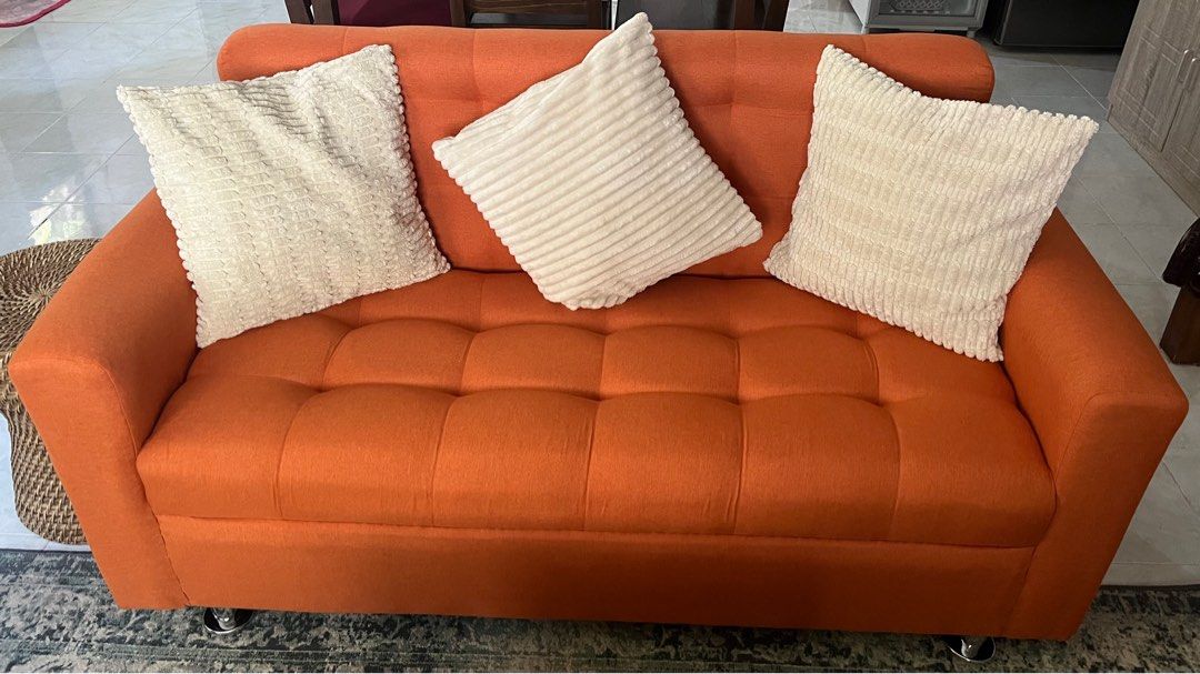 Orange Three Seater Sofa With Dimples (Category: Sofas) located in Las Pinas. Submitted by abby_e_g (Listing ID 1299628415, Image 1). Description: Uratex Foam Italian Fabric Solid Wooden Frame that will last Easy to maintain L60 inches W26 inches H32 inches Ship via lalamove only or pick up Gcash/BPI Payment Made to order for other colours.
