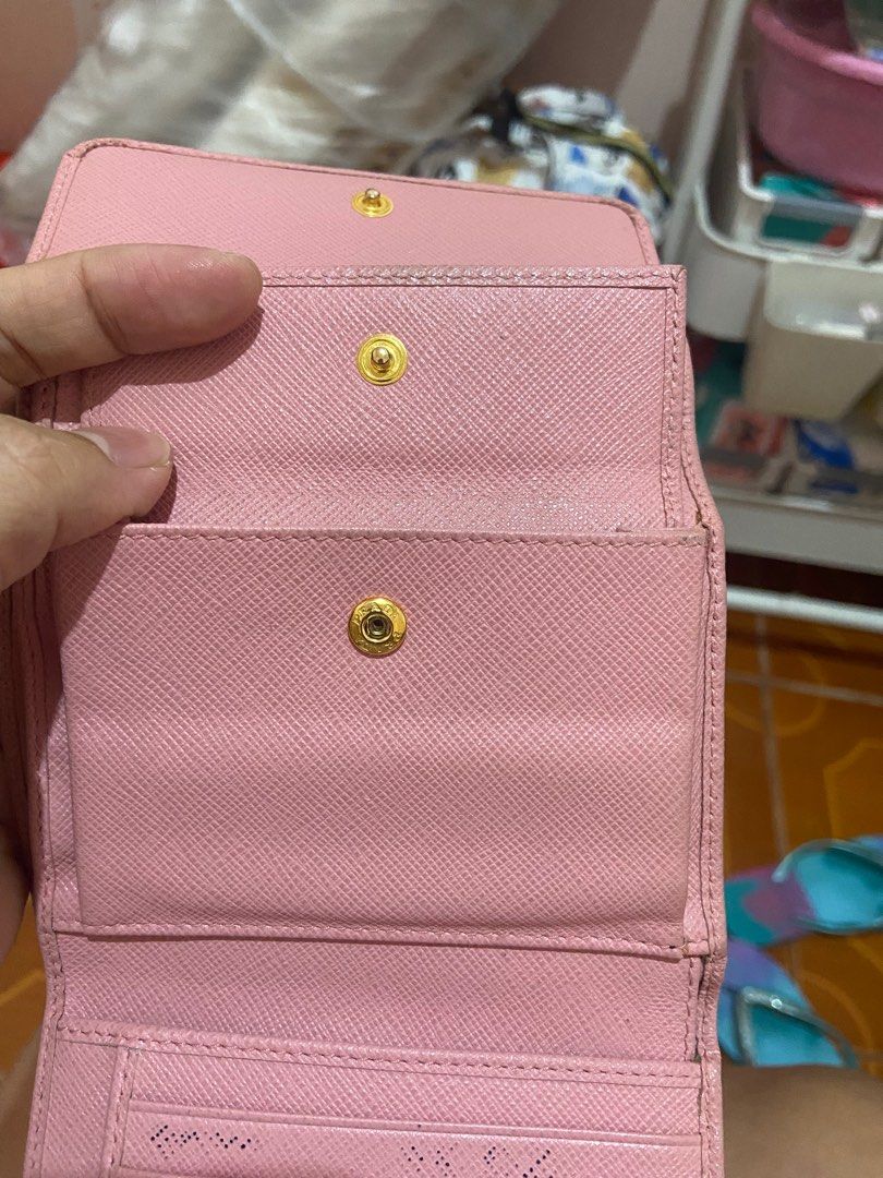 Original bifold Prada wallet (Category: Luxury Bags & Wallets) located in Urdaneta. Submitted by trendybg (Listing ID 1290168170, Image 3). Description: Money back guaranteed Do refund if proven fake Rfs: declutter Flaws: last photo coins compartment needs clining.