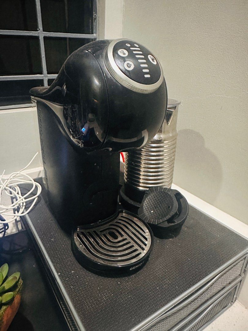 Nescafe Dolce Gusto Genio S Plus (Category: Coffee Machines & Makers) located in Cainta. Submitted by jes_fac (Listing ID 1299889932, Image 1). Description: Slightly used Dolce Gusto Genio S Plus Coffee Machine complete with box with Freebies: *Coffee pod rotating rack *Coffee pod 2-layer drawer *Capsule converter (to make it compatible with Nespresso pods) *Slightly negotiable.
