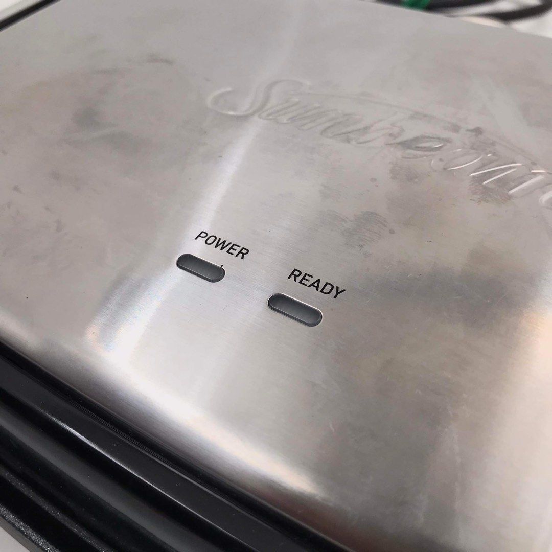SUNBEAM Café Style 2-Slice Sandwich Press & Grill (Category: Breadmakers) located in Pasay City. Submitted by enrico_appliances (Listing ID 1299824549, Image 3). Description: -Power Rating: 230-240V ~ 50Hz / 1650-1800 Watts -Unit Model: GRM2000SS -Features: AnyHeight Control™ Lever; 2 Slice capacity; Distributing heat; Folds and stands -Allows for multiple height adjustment and versatile top plate-lock -Create evenly browned toasties with beautif