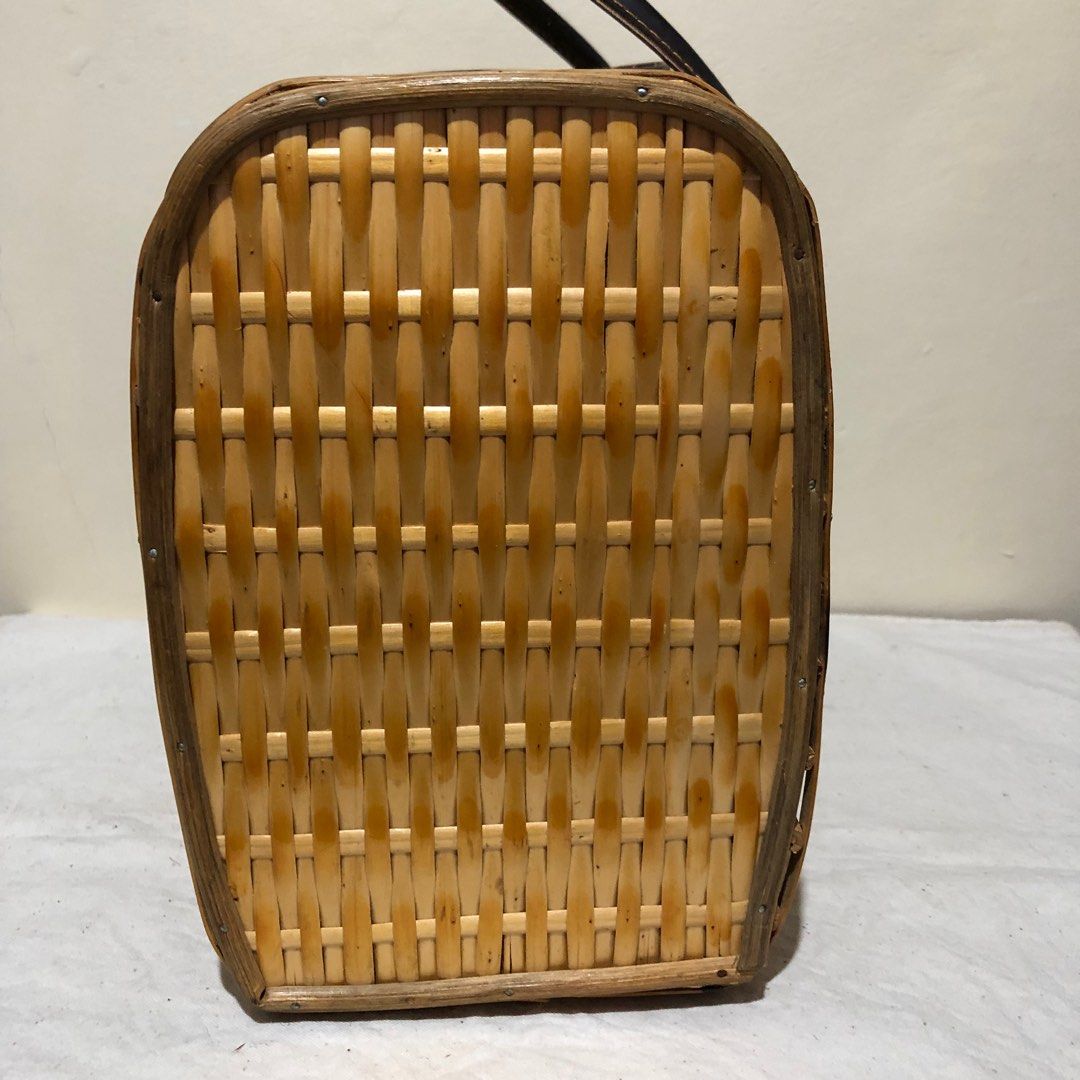 top handle beach bag (Category: Luxury Bags & Wallets) located in Caloocan City. Submitted by e_o62059 (Listing ID 1299900358, Image 3). Description: Japan auction handpicked; rattan wood materials; only issue-And 1 stud screw missing that replaced by metal wire. Pls see last photo Barely noticeable Size- L12in xH 8.5in x W 6in.