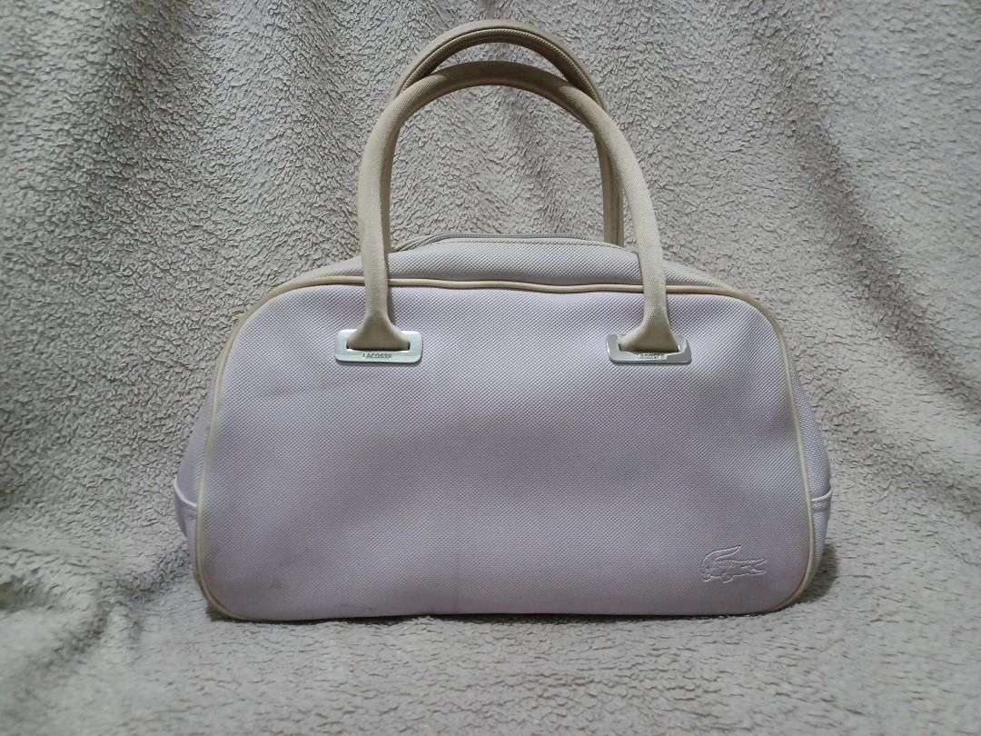 Lacoste Bowling Bag Small (Category: Luxury Bags & Wallets) located in Quezon City. Submitted by ianelles.closet (Listing ID 1300011004, Image 1). Description: *will update pix. slighty dirty from storage. needs cleaning only *lavander color.