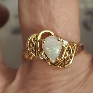 14k real gold opal ring , size is 5, solid for everyday use