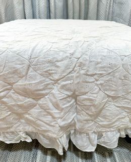 Pre-owned white eyelet mattress cover