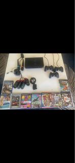 PlayStation 2 accessoires for sale:  controllers and games