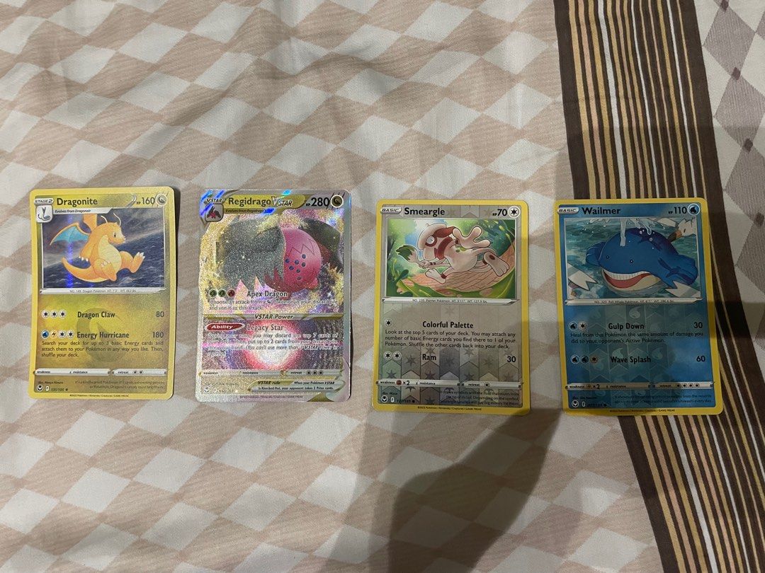 Pokmon cards silver tempest dragonite and regidrago v star, Hobbies &  Toys, Toys & Games on Carousell