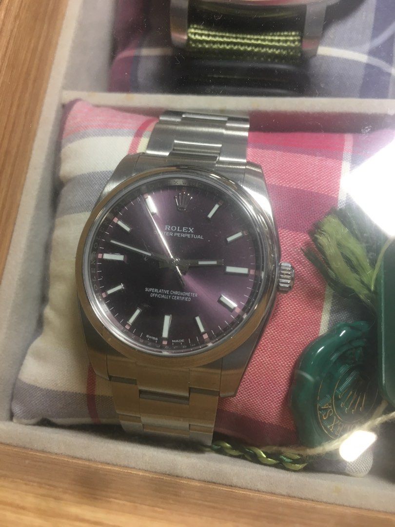 Rolex 114200 purple grapes dial (Category: Watches) located in Singapore. Submitted by aberdeen2 (Listing ID 1300315905, Image 1). Description: Brand New Unsized Stickers still around All Screws all no screw marks End production models Thus very collectible Very unique and desirable purple dial Reluctant sale .