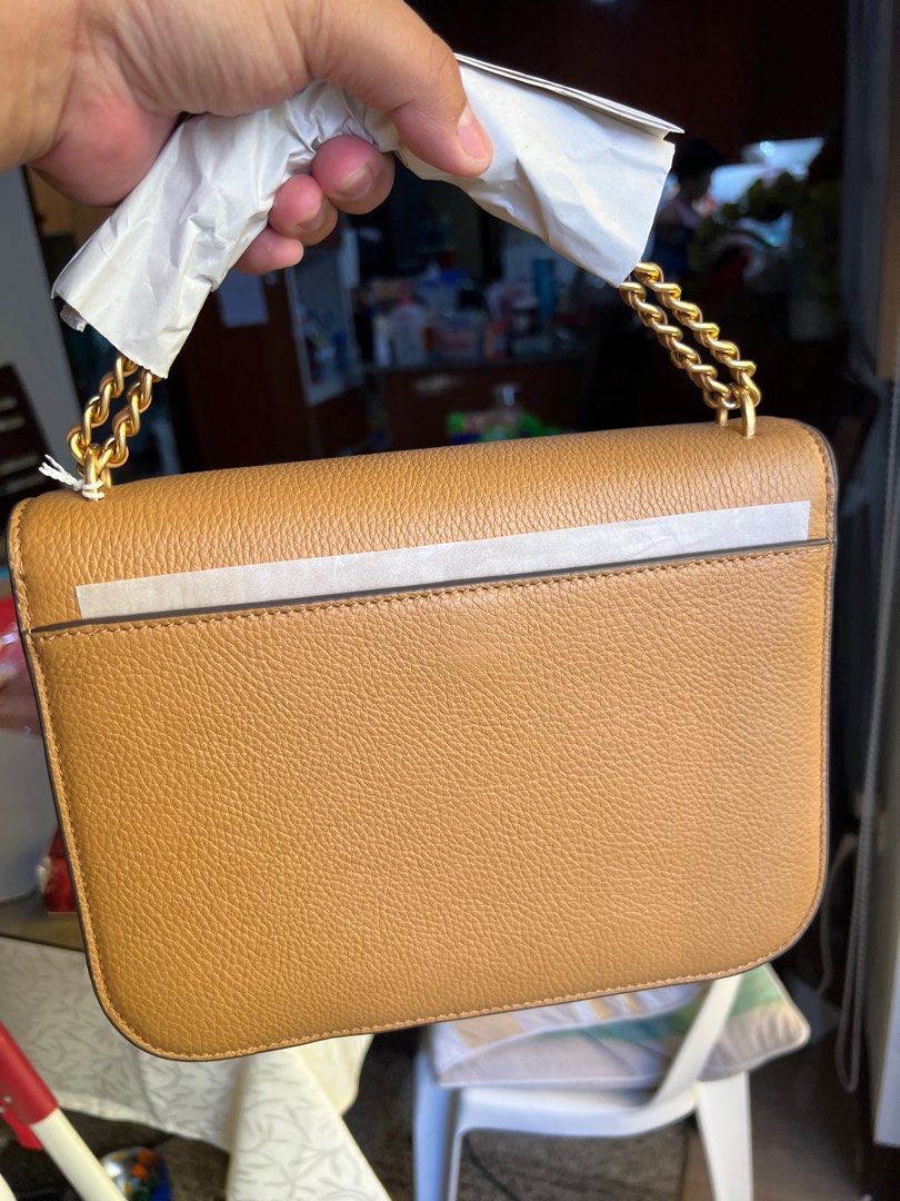 Tory Burch Britten Medium Adjustable Shoulder Bag (Category: Luxury Bags & Wallets) located in San Pedro. Submitted by misslumi (Listing ID 1300429160, Image 2). Description: 2 pcs ONHAND Brand New from US Outlet! 💯 original! Money back guarantee if proven fake! Inclusions: ✅Polyplastic, tags, paper bag ❌ dust bag - Solid shade pebbled shoulder bag with logo emblem - Genuine leather - Main flap with magnetic closure - Lined interior - Interior f
