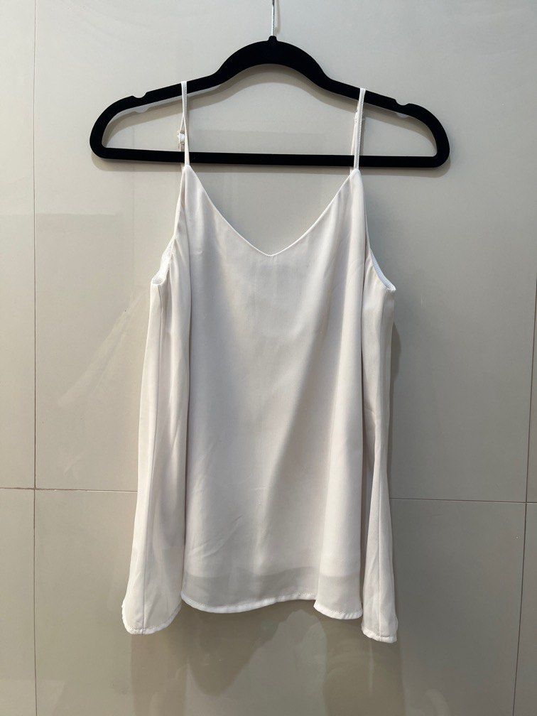 White top spaghetti adjustable strap (Category: Others Tops) located in Manila. Submitted by ar_things (Listing ID 1300325918, Image 1). Description: RFS: Extreme decluttering hence all items are at its lowest price. Condition of item is stated above. Please check all the photos for details. 😊 .