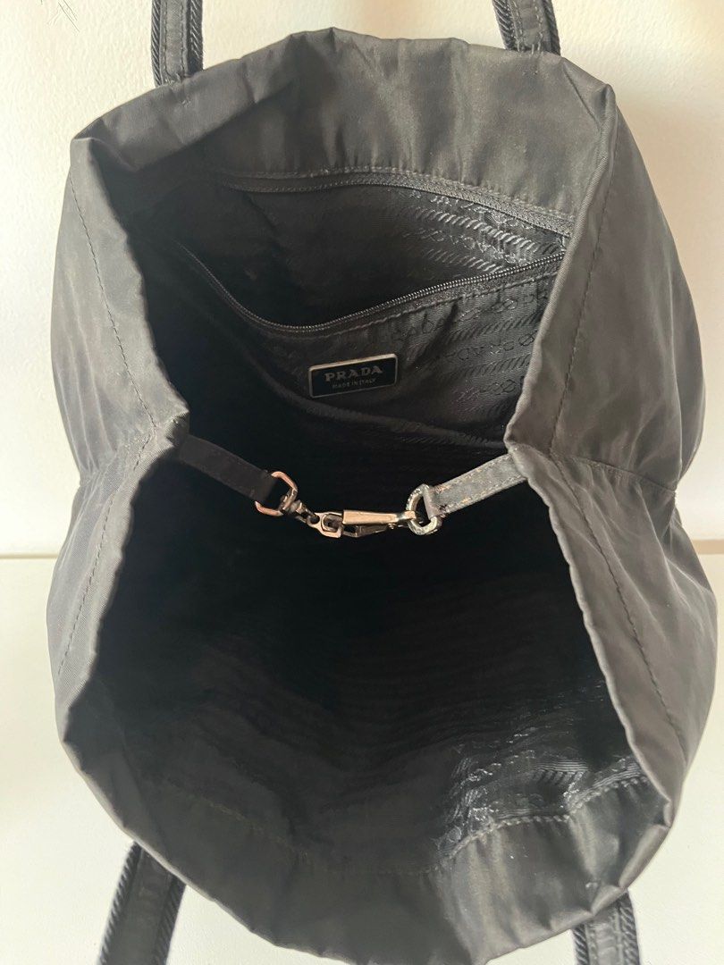 Authentic PRADA Nylon Shoulder Tote Hand Bag Black J4099 (Category: Luxury Bags & Wallets) located in Cavite. Submitted by letsgosab (Listing ID 1300541872, Image 2). Description: Prada Black Tote bag Authentic PRADA Nylon Shoulder Tote Hand Bag Black J4099 Bag Height 7.9inches (20cm) Bag Length 9.4inches (24cm) Note: Detailed photos available as per request ..