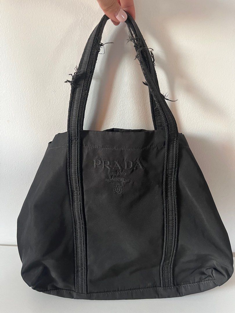 Authentic PRADA Nylon Shoulder Tote Hand Bag Black J4099 (Category: Luxury Bags & Wallets) located in Cavite. Submitted by letsgosab (Listing ID 1300541872, Image 1). Description: Prada Black Tote bag Authentic PRADA Nylon Shoulder Tote Hand Bag Black J4099 Bag Height 7.9inches (20cm) Bag Length 9.4inches (24cm) Note: Detailed photos available as per request ..