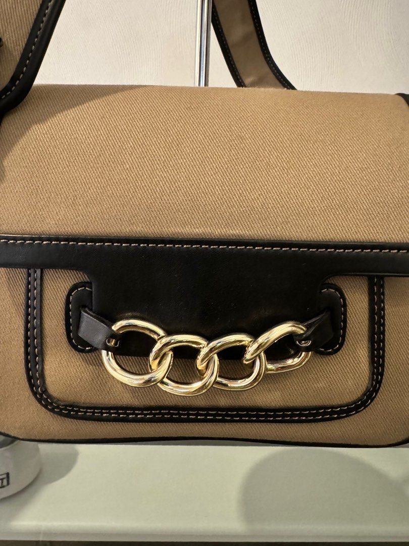 Authentic ZARA shoulder bag (Category: Luxury Bags & Wallets) located in San Fernando. Submitted by authenticsph (Listing ID 1300611824, Image 2). Description: Like New Size: 7x9inches Color: khaki Very minimal dirt mark (last pic) not noticeable in actual Fabric and leather combination Gold pa hardwares Magaan di nakakangalay sa shoulder. Very chic when worn.