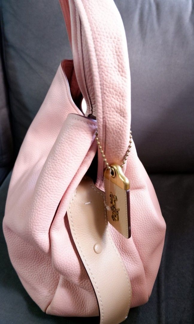 Coach Bandit Hobo Bag (Category: Luxury Bags & Wallets) located in Antipolo. Submitted by frustratedentrep (Listing ID 1300539517, Image 3). Description: Selling this Coach Bandit Hobo Bag, comes with a paper bag, no tag. Bnew, never used. rfs: not gonna use it. This bag feature a zipped pocket which snaps in on either side but can also be taken out and be used as a small bag on its own. So it's like buying 2 bags already. Store Price: 695usd Sel