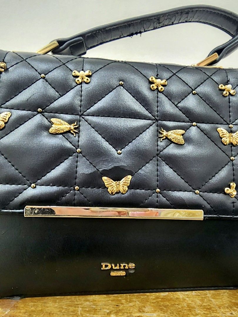 Dune London Bag (Category: Luxury Bags & Wallets) located in Quezon City. Submitted by jelsellit (Listing ID 1300528433, Image 2). Description: bought it for 6k selling for 2.5k lowered price to 900 purchased at Dune London BGC branch well used got flaws as shown in the photo, but can be restored i need to empty the cabinets for new items asap.