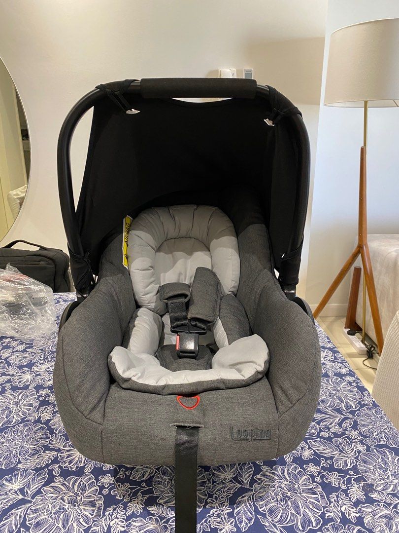 Looping Squizz 0+ Carseat with Adapter (Used Once) (Category: Car Seats) located in Pasig City. Submitted by celinerbueno (Listing ID 1300441432, Image 1). Description: The Looping Squizz 0+ Carseat with Adapter is a Squizz stroller-compatible car seat that lets moms easily move their little child from the car to the stroller and back. With its one-click mechanism, it takes only a few seconds to detach the car seat from the car and install it on 