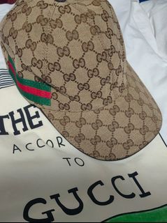 monogram cap with red and green trim and white cotton tshirt