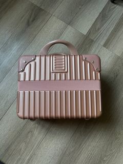 Pink hand carry tiny luggage