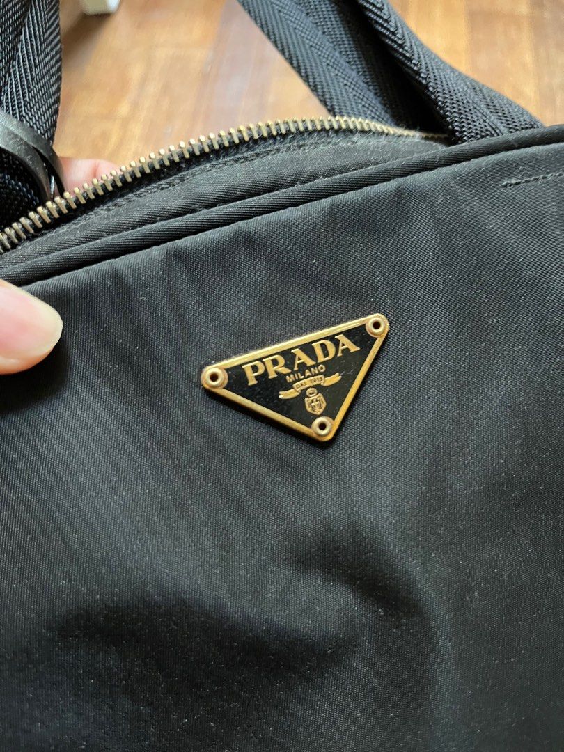 Prada (Category: Bags & Wallets) located in Subang Jaya. Submitted by rainbow_golden (Listing ID 1300485045, Image 2). Description: Bundle 3 bags. No cards no dust bags no receipt, selling as is. Super cheap deal just want to clear space. No nego, serious buyer pls 🙏🏻 If want to buy separate: Prada short handle Rm800 Michele kors shoulder Rm 200 Burberry blue label sling Rm 100 (SOLD).