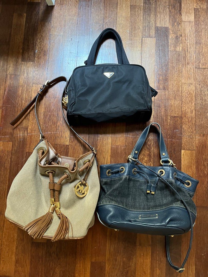 Prada (Category: Bags & Wallets) located in Subang Jaya. Submitted by rainbow_golden (Listing ID 1300485045, Image 1). Description: Bundle 3 bags. No cards no dust bags no receipt, selling as is. Super cheap deal just want to clear space. No nego, serious buyer pls 🙏🏻 If want to buy separate: Prada short handle Rm800 Michele kors shoulder Rm 200 Burberry blue label sling Rm 100 (SOLD).