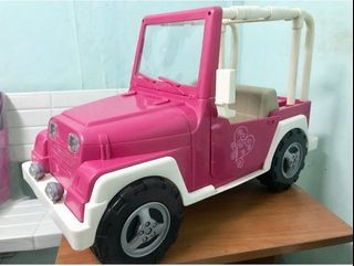 Take both! Our Generation Battat 18" doll with extra clothes and OG Jeep for 18" dolls