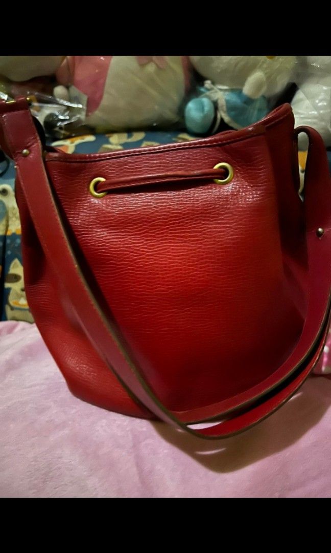 Christian Dior Small Bucket bag (Category: Luxury Bags & Wallets) located in Quezon City. Submitted by uptrendglam (Listing ID 1300661324, Image 3). Description: Christian Dior small bucket bag with engraved back to back CD and Christian Dior on the bag's metal design. Issue: Minor rubs on the interior side of the bag near zippered pocket and dirt on the inner side of the said pocket. Guaranteed authentic. RFS : Decluttering.