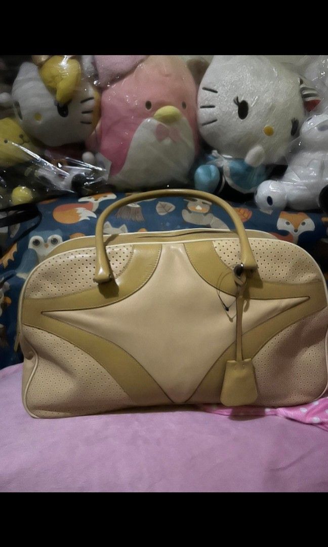 PRADA Bowling bag with combination lock (Category: Luxury Bags & Wallets) located in Quezon City. Submitted by uptrendglam (Listing ID 1300666229, Image 1). Description: Prada Bowler bag with combination lock and hangtag . The bag comes with an instruction on how to use the said lock. Minor signs of usage. Guaranteed authentic. Serial code no. 31. Please don't make offer as low as 60% off especially for a high end brand like Prada. Insulting offe