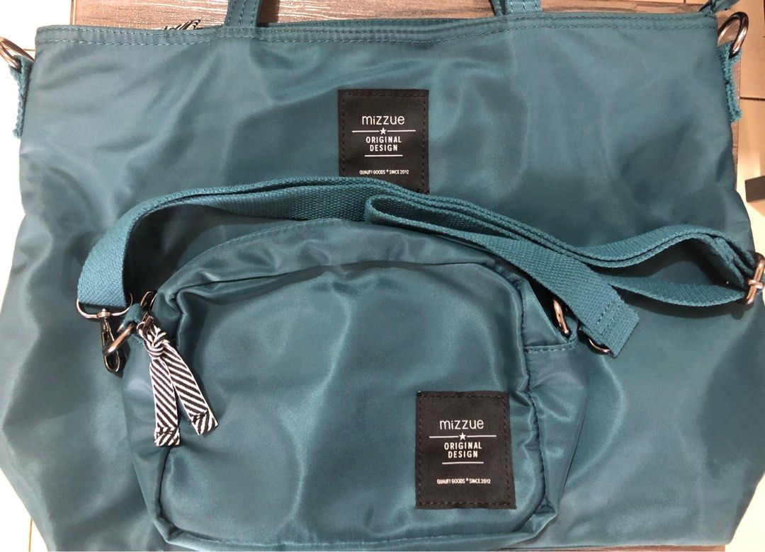 Mizzue Bag (Category: Tote Bags) located in Quezon City. Submitted by mamamonch (Listing ID 1296265546, Image 1). Description: Mizzue Agnus Bereznak green tote bag. In actual it’s more of dark teal. Comes with a detachable strap and pouch. No issues but still kindly manage your expectations as this is a pre-loved item..