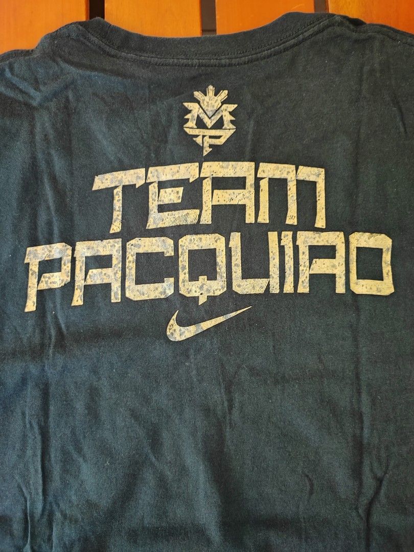 nike team pacquiao (Category: Tshirts & Polo Shirts ) located in Iloilo. Submitted by fj2015 (Listing ID 1296539996, Image 3). Description: nike team pacquiao gold font size: L (L: 28 W: 21) color rate: 9/10 some fade on the gold font rfs: decluttering.
