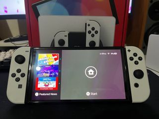 Nintendo Switch OLED w/ 3 physical games