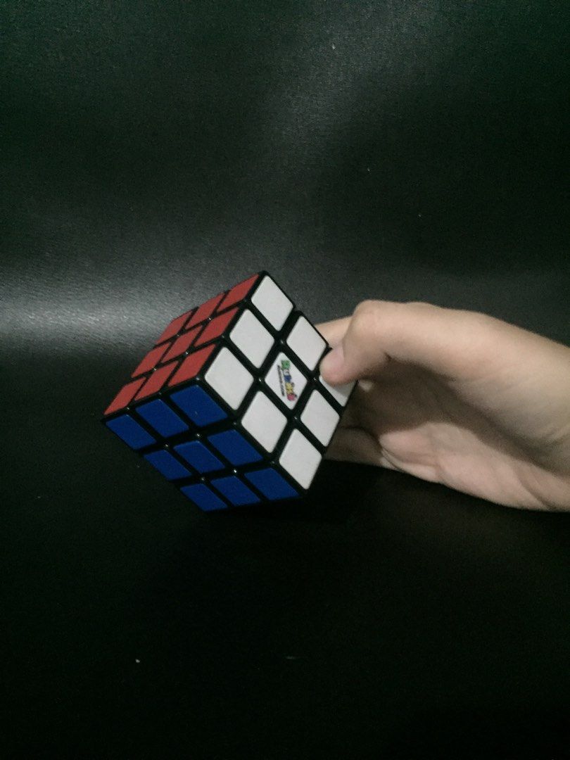 Original Rubiks Cube (Category: Board Games & Puzzles) located in Makati City. Submitted by manimoo210 (Listing ID 1296563174, Image 1). Description: Bought this around 2018, with my pamasko. Bought it for 500 now a days this retail mga 600+. Has a bit of scratches and the icon in the white side is kind of fading but still playable.