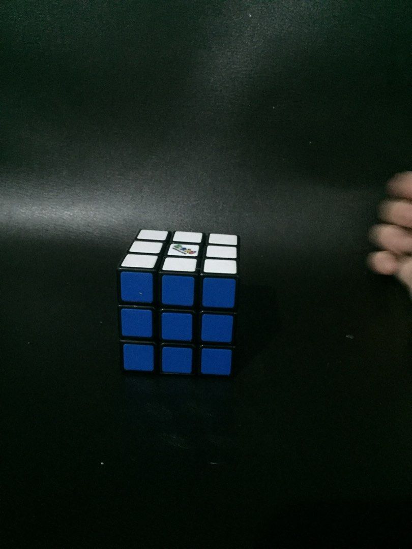 Original Rubiks Cube (Category: Board Games & Puzzles) located in Makati City. Submitted by manimoo210 (Listing ID 1296563174, Image 3). Description: Bought this around 2018, with my pamasko. Bought it for 500 now a days this retail mga 600+. Has a bit of scratches and the icon in the white side is kind of fading but still playable.