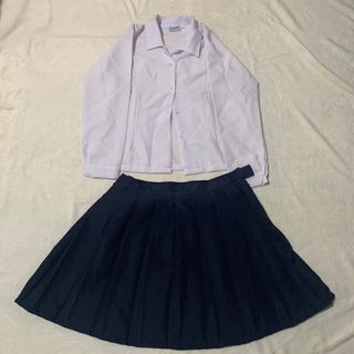 School girl uniform white polo blouse navy pleated skirt