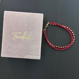Trinkets double red stone bracelet with 10k gold balls