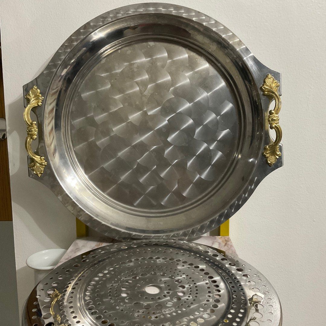 Stainless fruit/food server tray (Category: Other Kitchenware & Tableware) located in Caloocan City. Submitted by e_o62059 (Listing ID 1296730457, Image 2). Description: Japan brand,in original box;gold handle color fully intact;unused; no rust;stainless Issue -watermark due to cleaning and minor scratches due to prolong storage TRAY Size- 35cm x 37.5cm x 2.8cm (w/o handle) STRAINER size- 27cm.