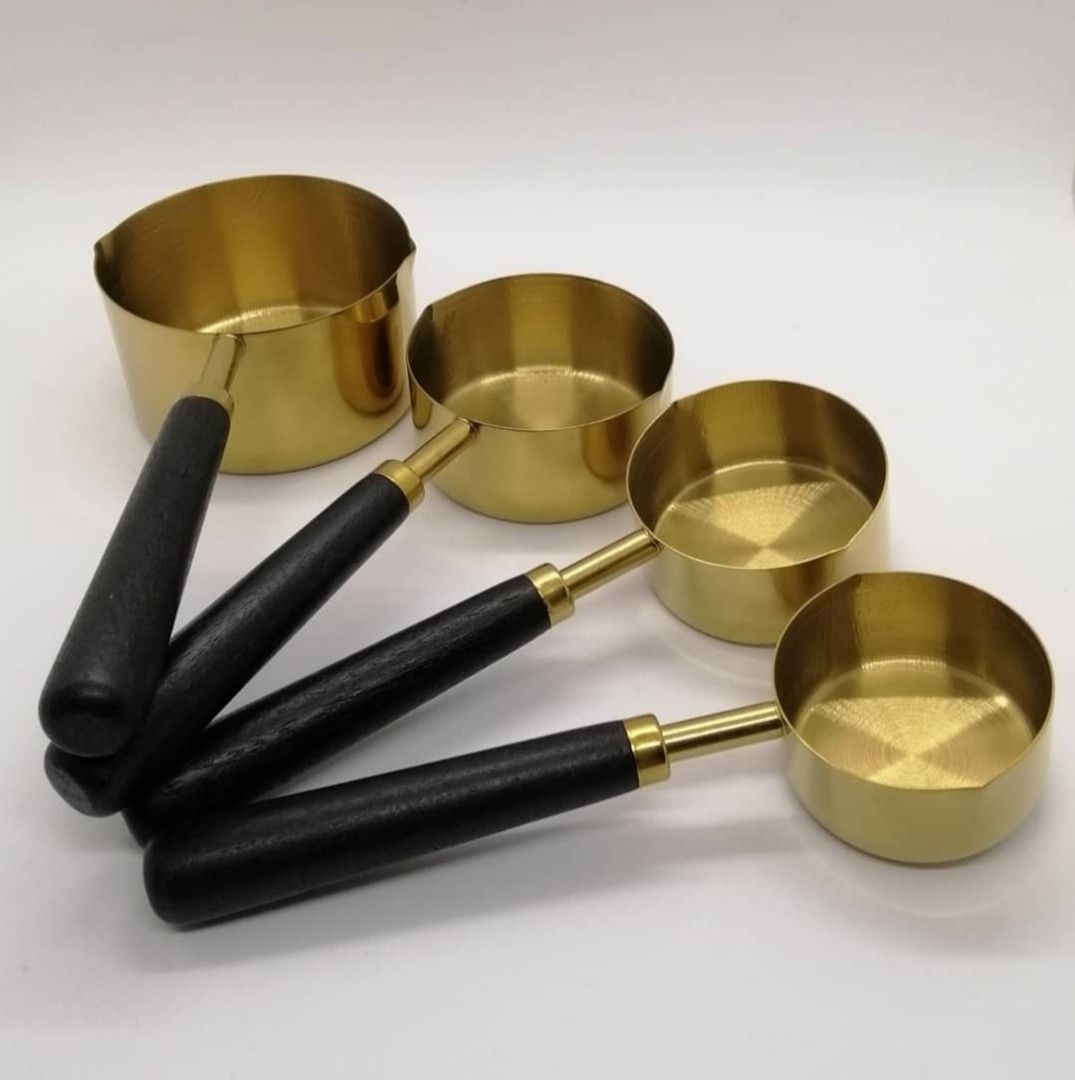 Gold measuring cup & spoon set with wood handle (Category: Bakeware) located in Paranaque City. Submitted by missteks1016 (Listing ID 1296895502, Image 3). Description: Durable and food frade stainless steel with premium wood handle comes in box.