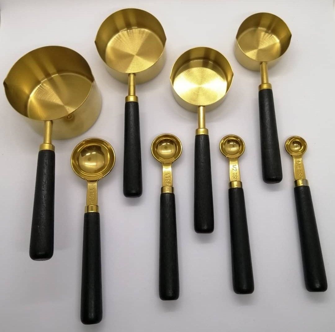 Gold measuring cup & spoon set with wood handle (Category: Bakeware) located in Paranaque City. Submitted by missteks1016 (Listing ID 1296895502, Image 2). Description: Durable and food frade stainless steel with premium wood handle comes in box.