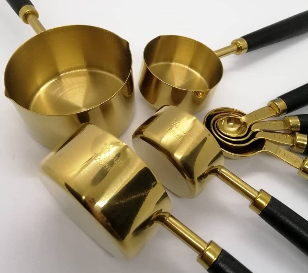 Gold measuring cup & spoon set with wood handle (Category: Bakeware) located in Paranaque City. Submitted by missteks1016 (Listing ID 1296895502, Image 1). Description: Durable and food frade stainless steel with premium wood handle comes in box.