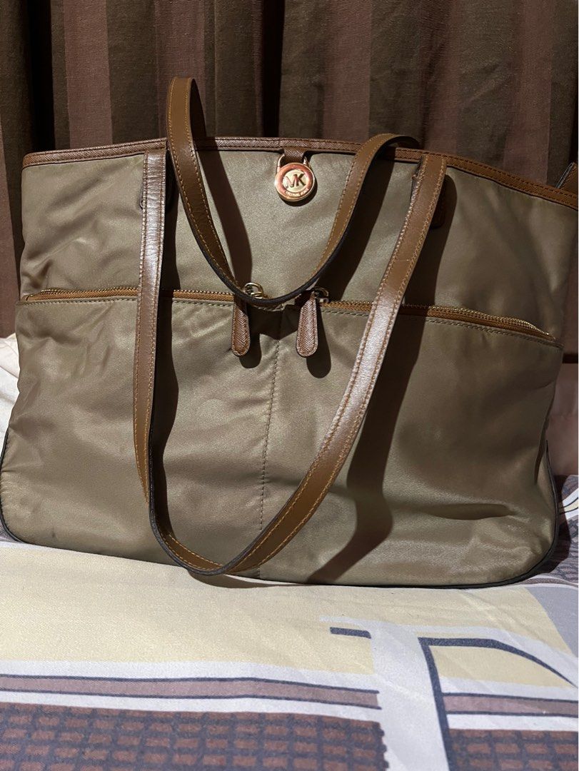 mk tote bag authentic (Category: Luxury Bags & Wallets) located in Makati City. Submitted by sinner_or_saint101 (Listing ID 1288239141, Image 1). Description: nylon mk bag light brown 11x16.