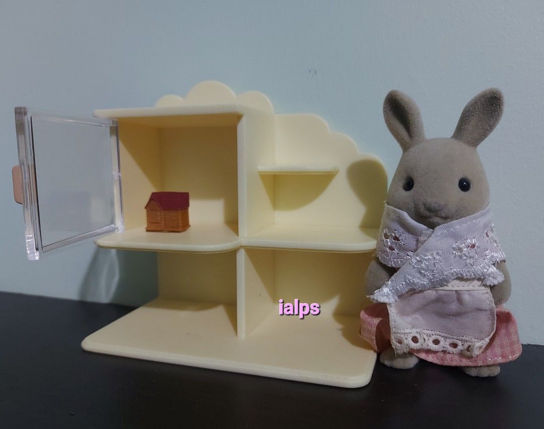 Sylvanian Families Toy Shop Dollhouse Display Cabinet with Miniature House (Category: Shelves, Cabinets & Racks) located in Angono. Submitted by lpsflover (Listing ID 1296848342, Image 2). Description: Can be used as bookshelf or display cabinet for your house or shops. Figure is not included. Transparent door is intact. Miniature dollhouse is included. Not for fussy lowballers. Payment via BPI/BDO/Gcash and delivery is via Lalamove to be shoulde