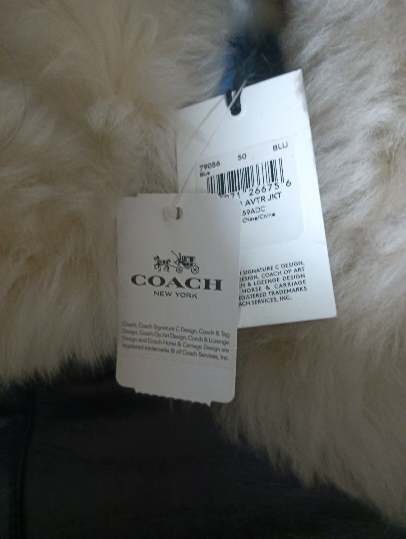 Winter Jacket (Category: Apparel) located in Singapore. Submitted by bobo_kiddos (Listing ID 1296776162, Image 2). Description: ma dad coach winter jacket as you can still see the brand tag along. keep for so long,never use before,as its leather so some is peeling off as you can senn and bit of dirty on the collar,should be ok after some hand wash. can nego need to get it off...