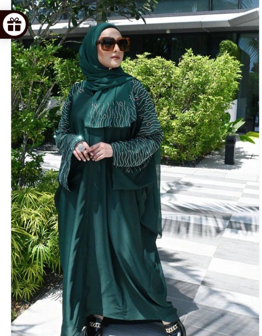 Abaya Ruby (Category: Kaftans & Jubahs) located in Singapore. Submitted by mona_97 (Listing ID 1296956622, Image 1). Description: beautiful farasha abaya that comes with crystal and red embedded stones on neck till wrist and back area...size 56.