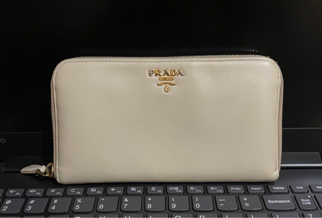 Prada Saffiano Wallet (Category: Luxury Bags & Wallets) located in Cavite. Submitted by HelloAnn_Closet (Listing ID 1296947271, Image 1). Description: Selling my Prada Saffiano wallet. Guaranteed authentic. RFS: already using WOC Very pretty in actual. Pictures will be sent upon request. .
