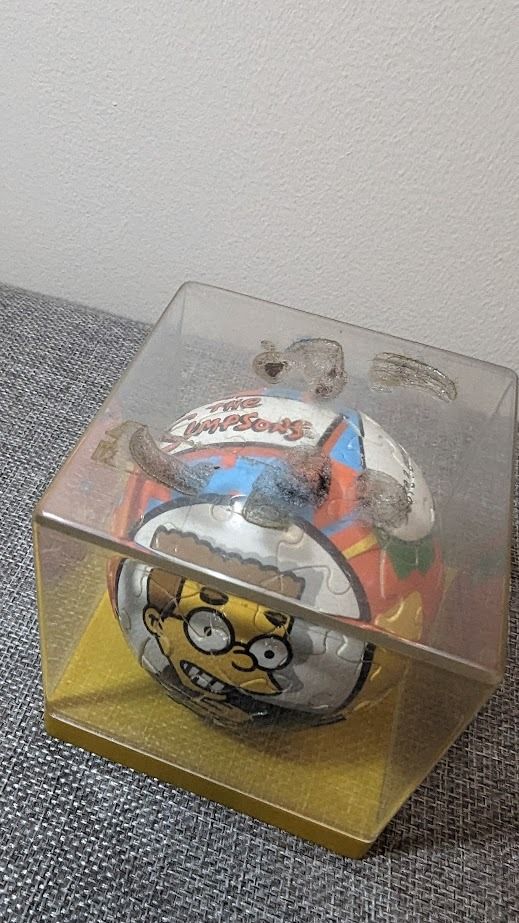 THE SIMPSONS Puzzleball Waylon Smithers 60 pcs (Category: Board Games & Puzzles) located in Manila. Submitted by matrixfinds (Listing ID 1297054766, Image 2). Description: The Simpsons Character: Waylon Smithers Brand: Ravensburger Puzzle Ball Year: 2007 Pieces: 60 The puzzle is already finished and it is contained inside a small acrylic box for display. Top of the box has some marks/damages (see pictures) SOLD AS IS .