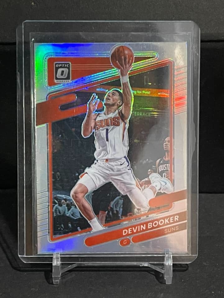 2021 Panini Optic Devin Booker Silver Holo (Category: Raw Singles) located in Quezon City. Submitted by hobbyboxph (Listing ID 1297070307, Image 1). Description: 2021 Panini Optic Devin Booker Silver Holo ***See pics for the card condition. Please use photos provided for your own assessment. What you see is what you get. ***No low balling. Low ballers will be ignored. ***Comes with card sleeves and toploader case ✅Last price: 250Php + SF ✅Mode of