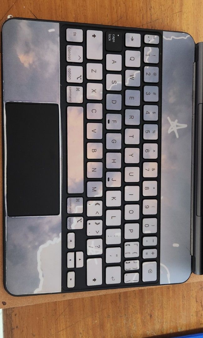 Apple Ipad magic keyboard - 11" (Category: Computer Keyboard) located in Cabuyao City. Submitted by AR700 (Listing ID 1297184662, Image 1). Description: magic keyboard for ipad used this for ipad pro 10.5 charger port at the side - working placed stickers with minor flaws comes with box.