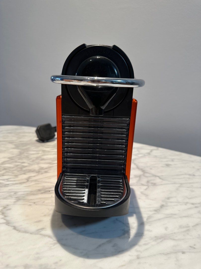 Nespresso Pixie Red (Category: Coffee Machines & Makers) located in Singapore. Submitted by police.case (Listing ID 1297159763, Image 4). Description: Bought in 2021, lightly used and still in excellent condition as it is very well maintained. couple of scratches here and there as u can see in the pictures but it’s due to natural wear and tear from usage. changing cos moved to new house, and got another Nespresso machine as gift. Able to use with