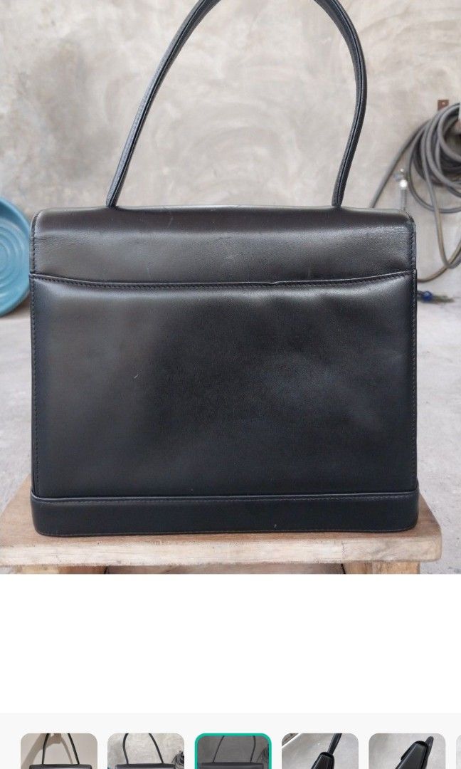 Original Givenchy Top Handle Bag (Category: Luxury Bags & Wallets) located in Manila. Submitted by fabulousfourty (Listing ID 1297237149, Image 2). Description: Original Givenchy top handle Bag Genuine Leather medium size and can fit your wallet, phone, glasses, others Can be worn for both normal and formal days Clean inside out RFS: Disposing some to make room for recently purchased bags Price negotiable.
