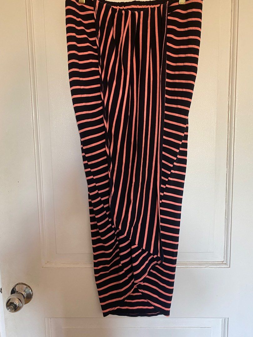 Striped Skirt (Category: Skirts) located in Paranaque City. Submitted by yard_army (Listing ID 1297138972, Image 1). Description: Imported Skirt Striped pink and dark blue 34” in length Nice fit Front slit-like detail, nice when worn 28” waist when laid flat. garterized. No stain, no damage..