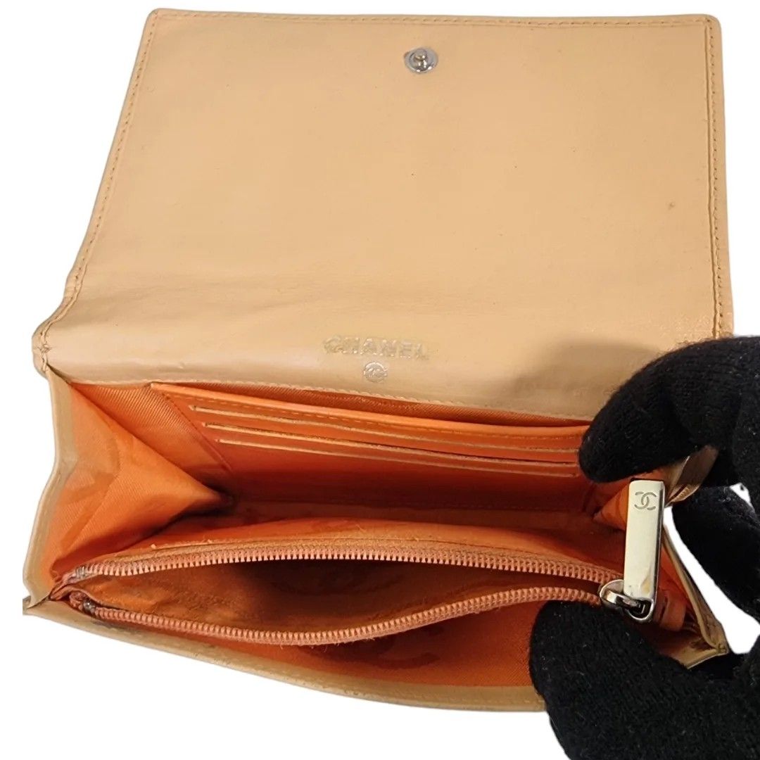 Authentic CHANEL flap Cambon wallet (Category: Luxury Bags & Wallets) located in Quezon City. Submitted by manerarestorationservices (Listing ID 1297244055, Image 3). Description: Money back Guarantee 💯% Guaranteed authentic *Brand: CC Cambon FLAP Compact wallet HOLOGRAM INTACT *Materials: Lambskin leather CC patent *Color: BEIGE *Size: Medium *Condition: 8/10 Color touchep up -Used * Inclusions: box only Open for LAYAWAY 20% down payment 80% pa
